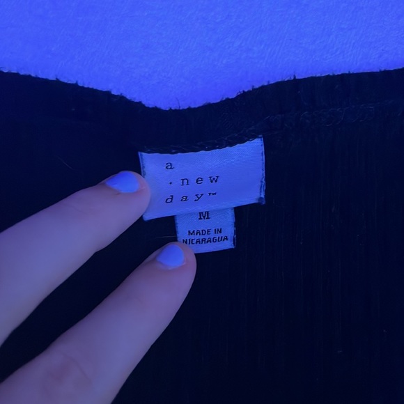 This is a compfy top from target. 71% Rayon, 21% Polyester, and 4% Spandex. - Picture 2 of 3